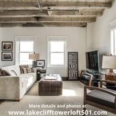 a living room with furniture a couch and a table