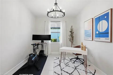 a view of a livingroom with furniture and a window