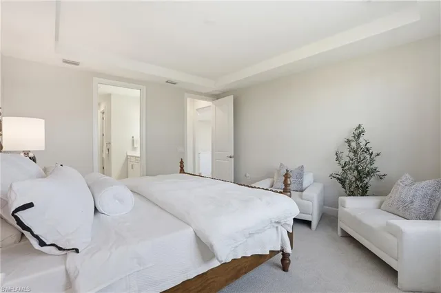 a bedroom with a bed and a couch