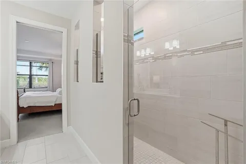 a bathroom with a tub shower and sink