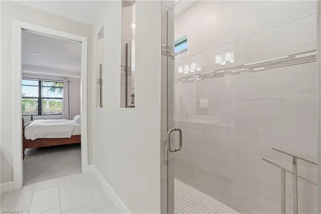 a bathroom with a tub shower and sink