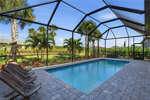 a view of a backyard with sitting area