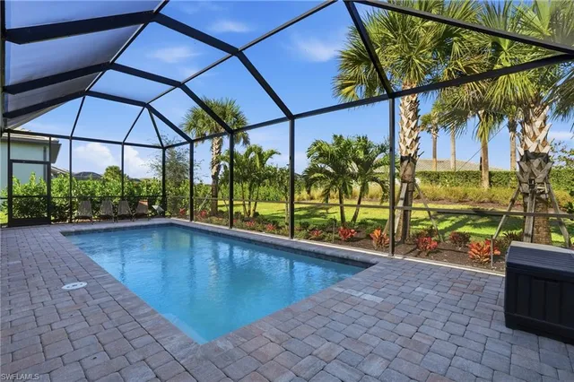 a view of a backyard with sitting area