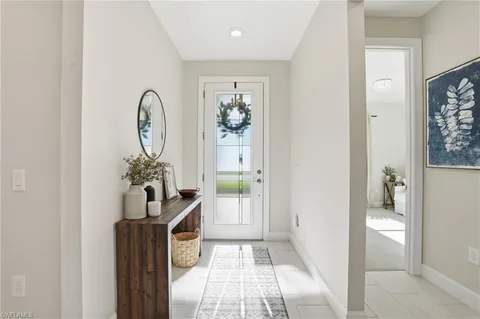 a view of an entryway with wooden floor
