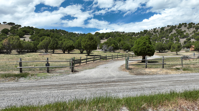 2006 Swenson Valley Road Bancroft, ID 83217 - Photo 17 of 51 Expansive rural property featuring a gravel driveway and a rustic wooden fence