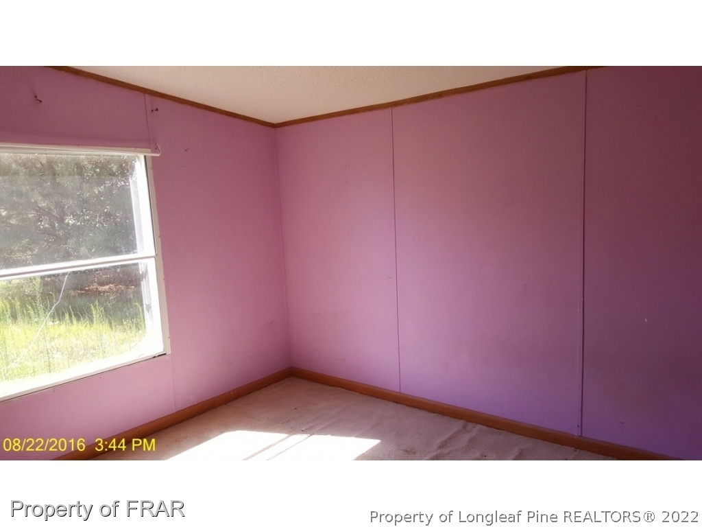 1113 Fire Lane Road Bunnlevel, NC 28323 - Photo 12 of 18 a view of an empty room and window
