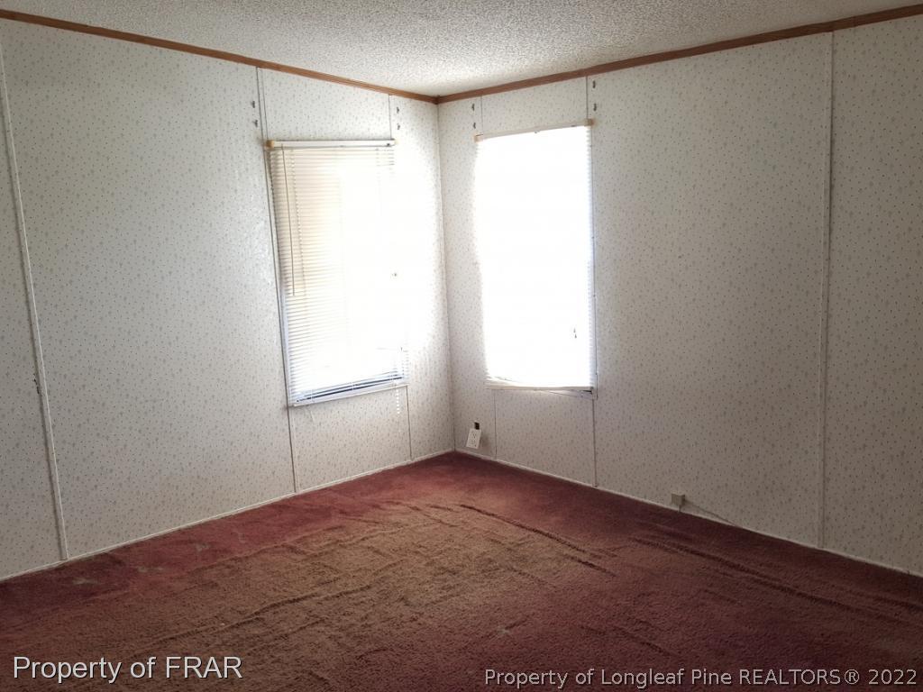 1113 Fire Lane Road Bunnlevel, NC 28323 - Photo 14 of 18 a view of an empty room with a window