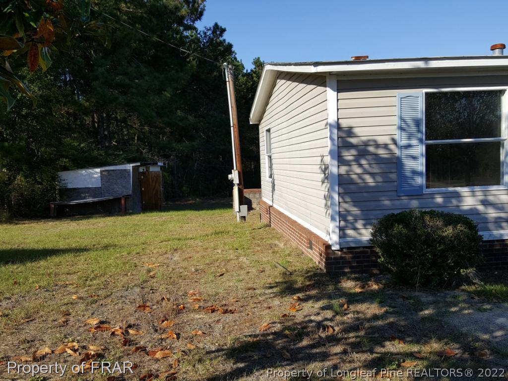 1113 Fire Lane Road Bunnlevel, NC 28323 - Photo 5 of 18 a view of a backyard