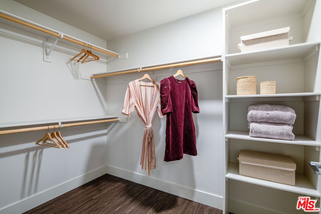 1101 North Main Street, Unit B326 Los Angeles, CA 90012 - Photo 8 of 35 a view of walk in closet with clothes and shoes