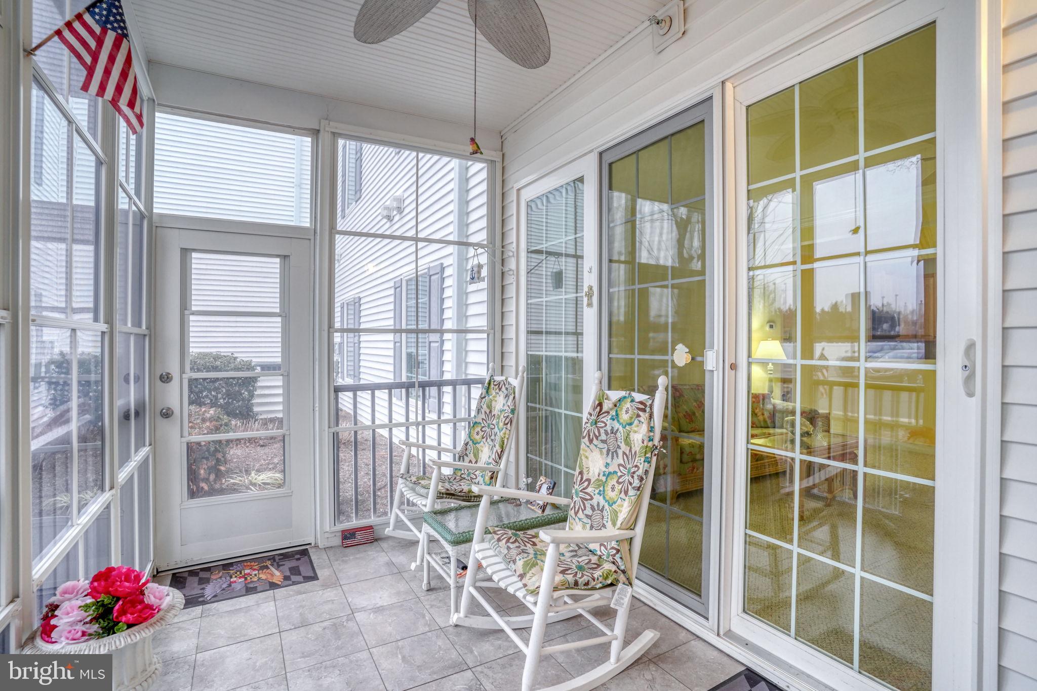 30611 Cedar Neck Road, Unit 2104 Ocean View, DE 19970 - Photo 5 of 57 3-Season Room, with patio door for access