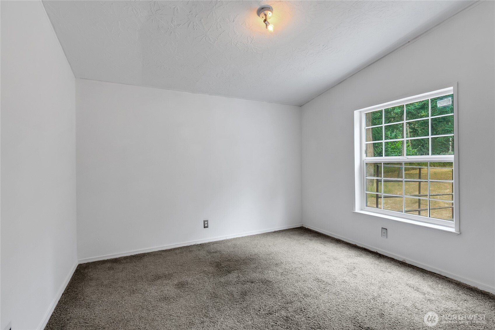 28205 73rd Avenue East Graham, WA 98338 - Photo 17 of 20 an empty room with a window