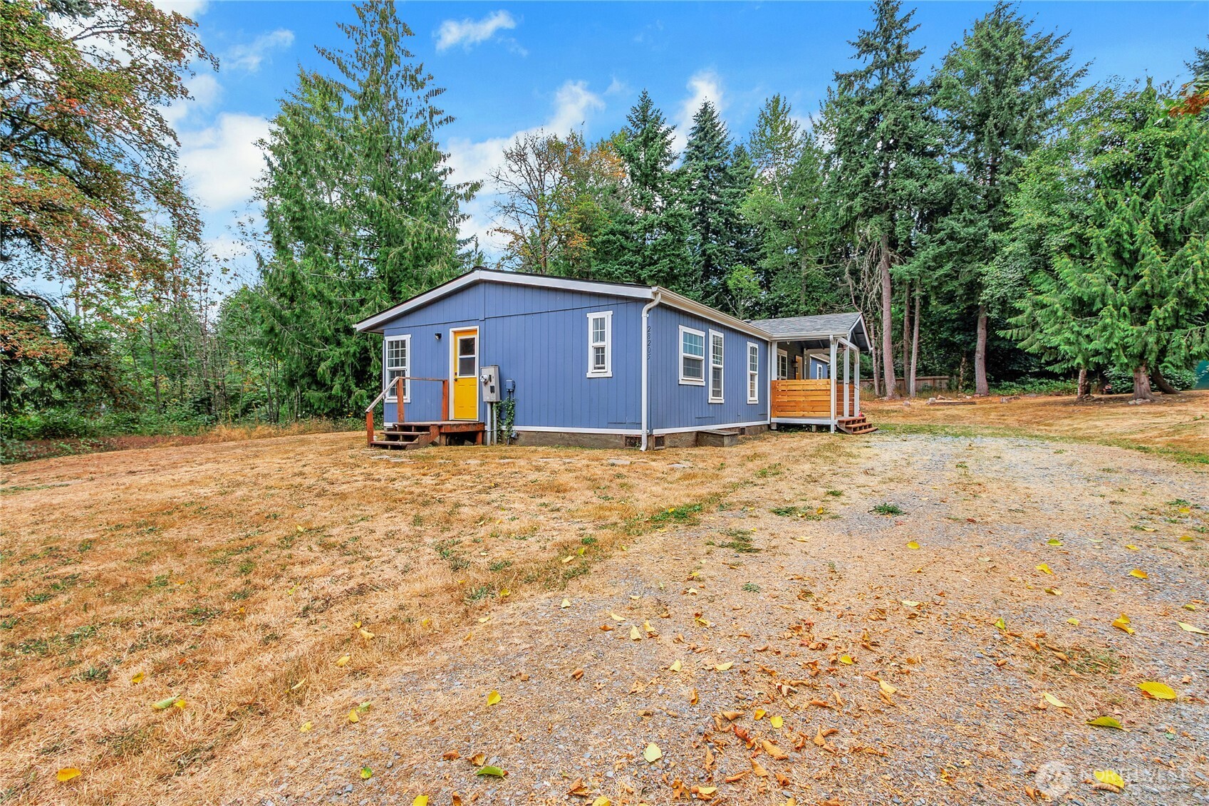 28205 73rd Avenue East Graham, WA 98338 - Photo 3 of 20 a house with trees in the background