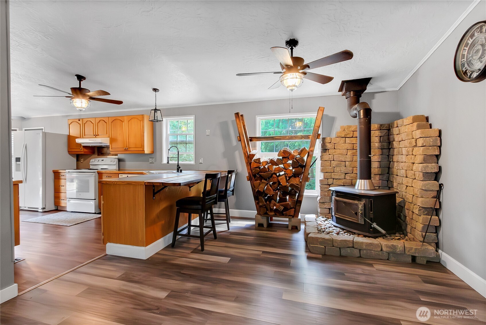 28205 73rd Avenue East Graham, WA 98338 - Photo 7 of 20 a living room with fireplace furniture and a flat screen tv