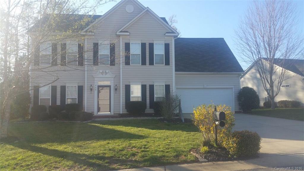 835 Haymarket Place Fort Mill, SC 29708 - Photo 1 of 8 a front view of a house with garden