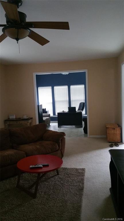 835 Haymarket Place Fort Mill, SC 29708 - Photo 3 of 8 a living room with furniture a rug and a large window