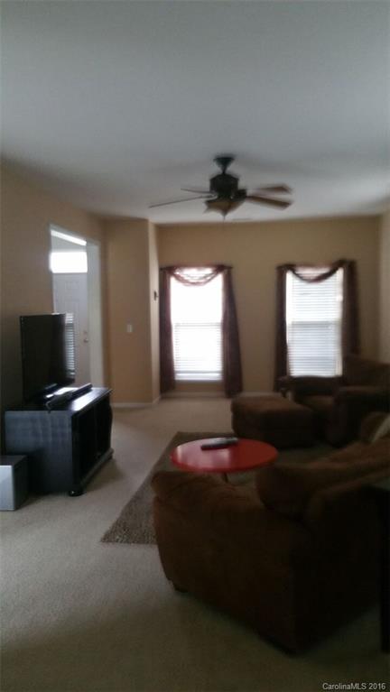 835 Haymarket Place Fort Mill, SC 29708 - Photo 4 of 8 a living room with furniture and a flat screen tv