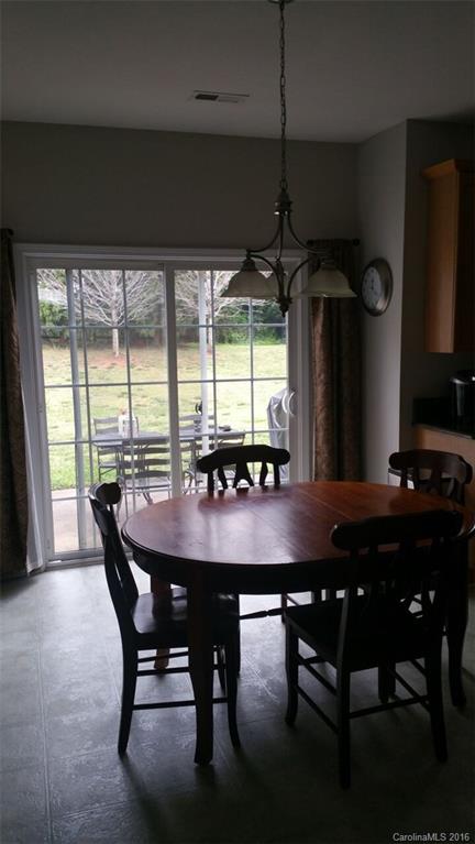 835 Haymarket Place Fort Mill, SC 29708 - Photo 5 of 8 a view of a dining room with furniture window and wooden floor