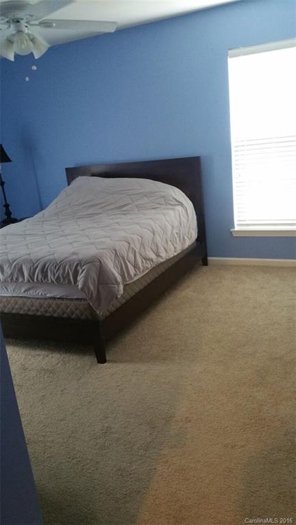 835 Haymarket Place Fort Mill, SC 29708 - Photo 6 of 8 a bedroom with a bed and a window