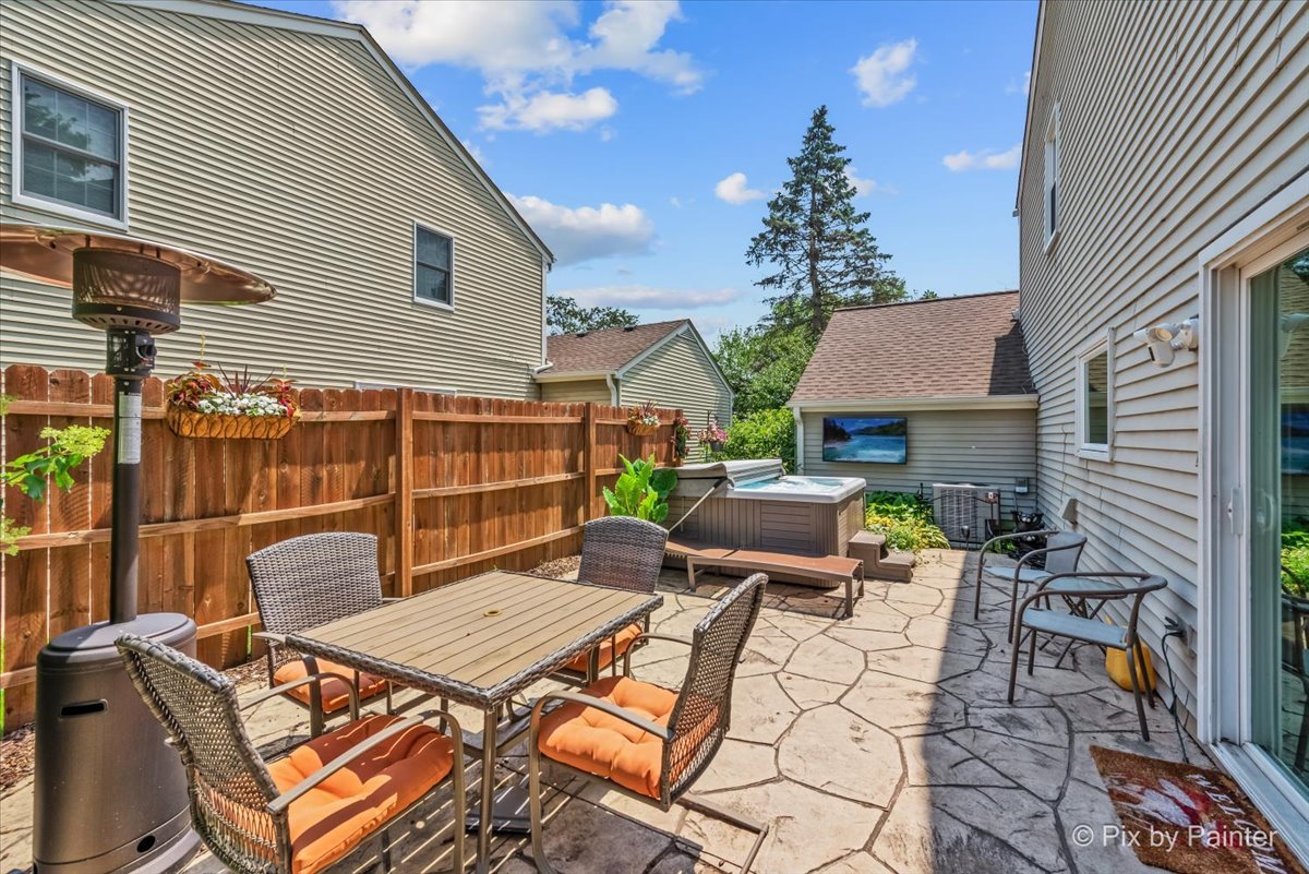 1085 Oswego Road Naperville, IL 60540 - Photo 25 of 31 a backyard of a house with seating space