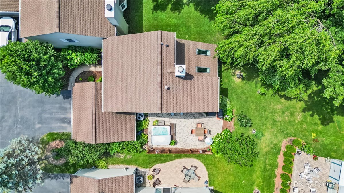 1085 Oswego Road Naperville, IL 60540 - Photo 29 of 31 an aerial view of a house with a yard and large trees