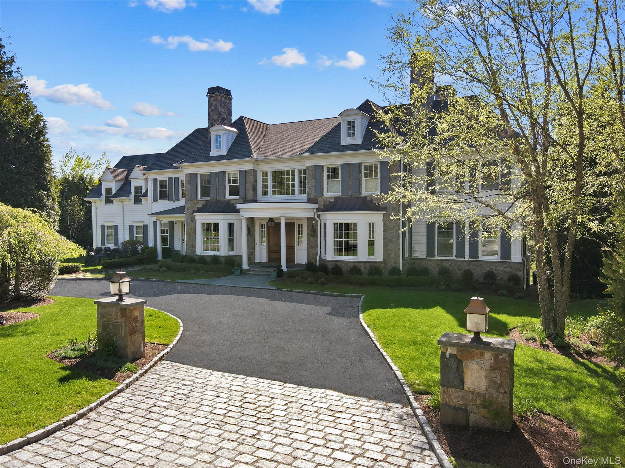 a front view of a house with swimming pool having outdoor seating