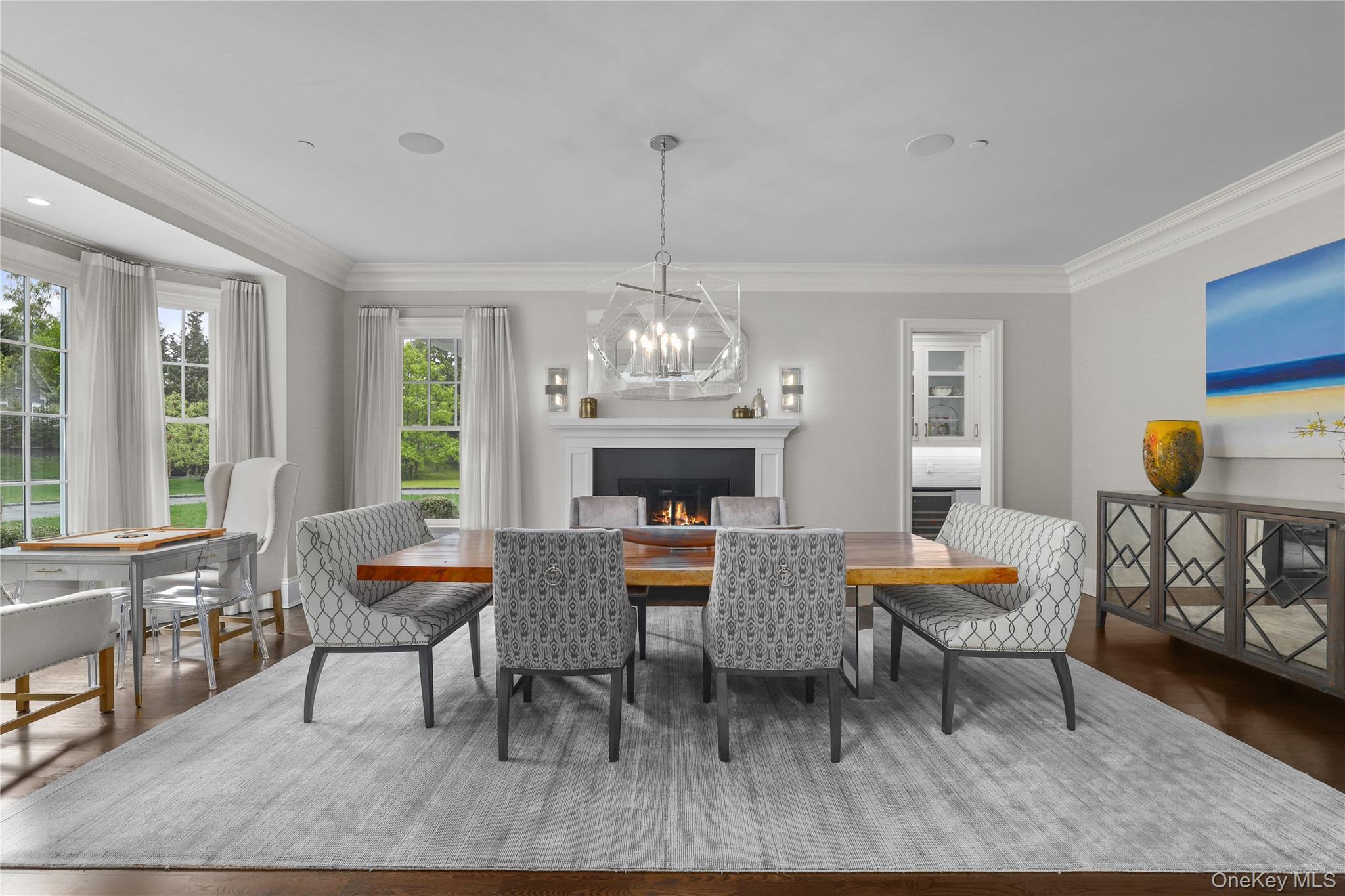 6 Stone Bridge Road Purchase, NY 10577 - Photo 13 of 45 a dining room with furniture a chandelier and wooden floor