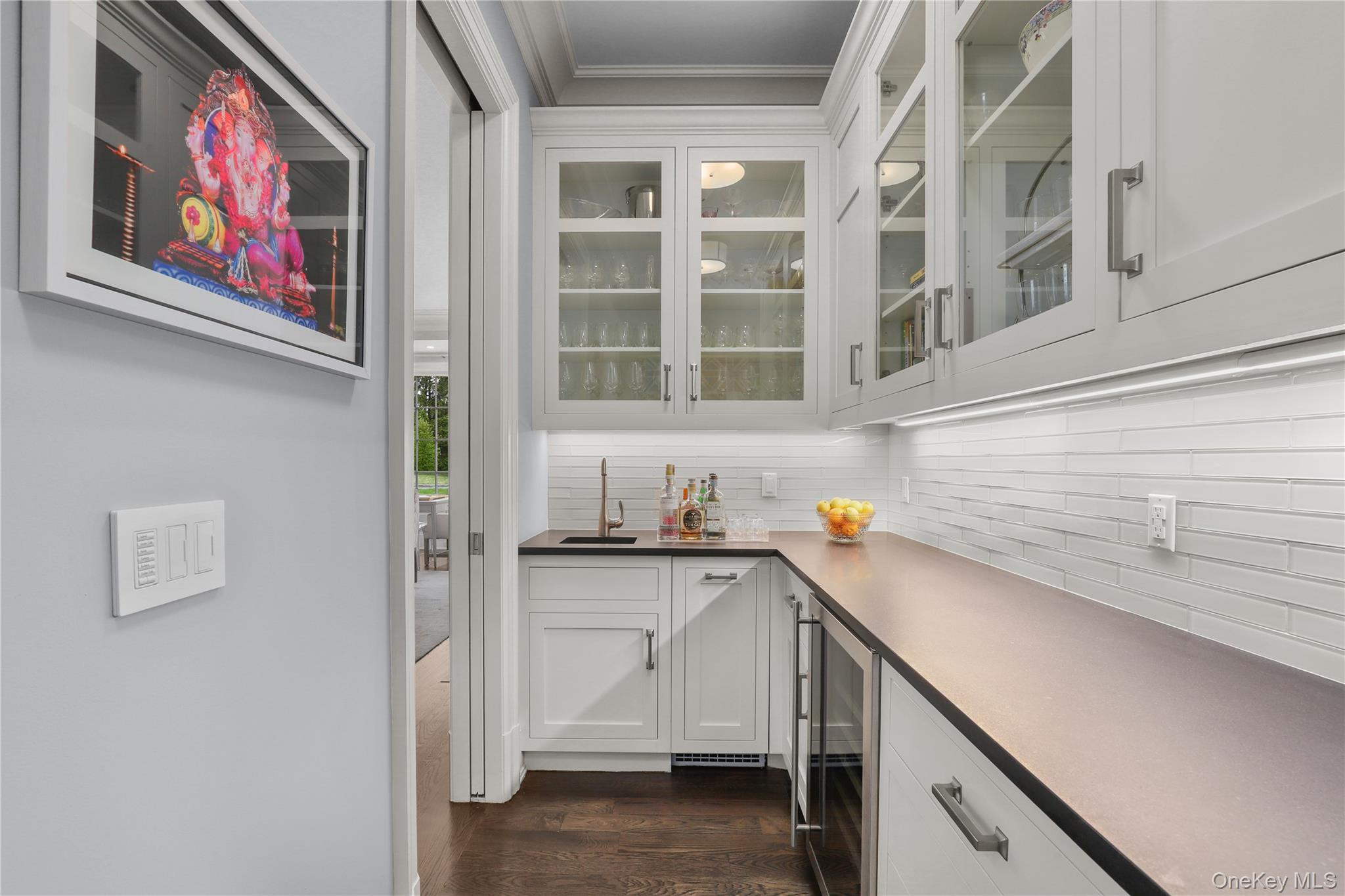 6 Stone Bridge Road Purchase, NY 10577 - Photo 14 of 45 a view of a kitchen with cabinets and wooden floor
