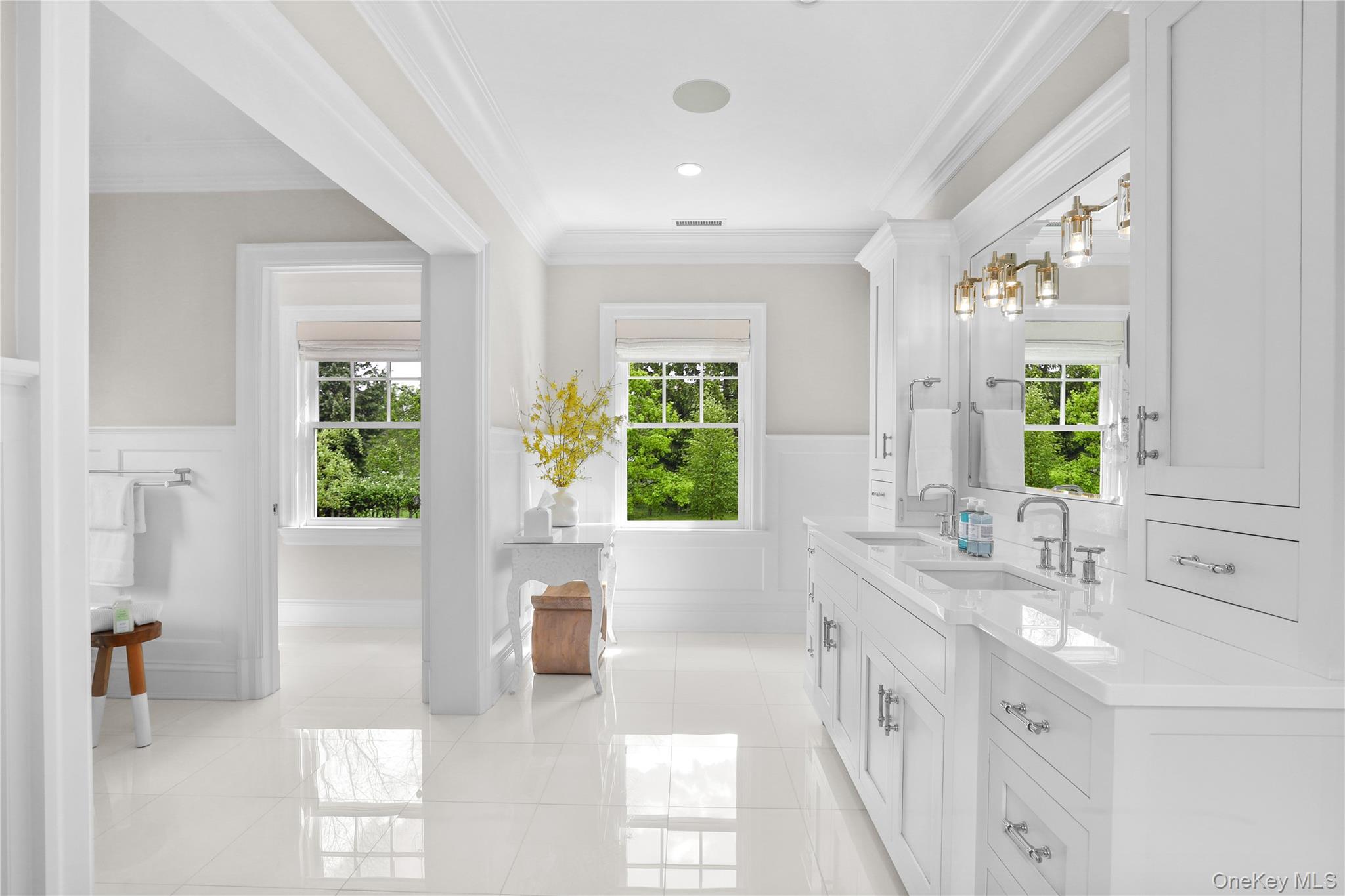 6 Stone Bridge Road Purchase, NY 10577 - Photo 20 of 45 a bathroom with a granite countertop sink and a large mirror