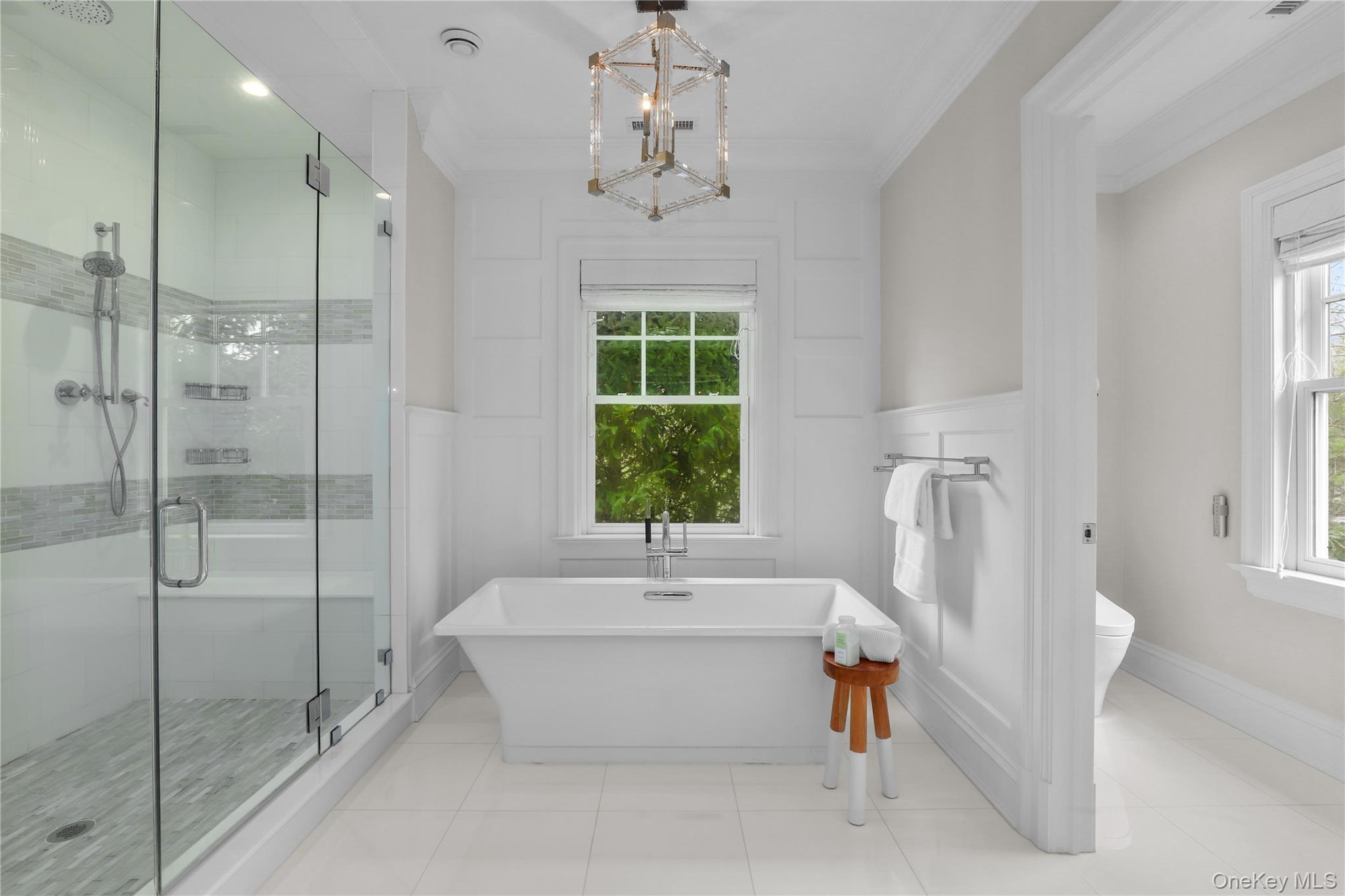 6 Stone Bridge Road Purchase, NY 10577 - Photo 21 of 45 a bathroom with a tub sink and window
