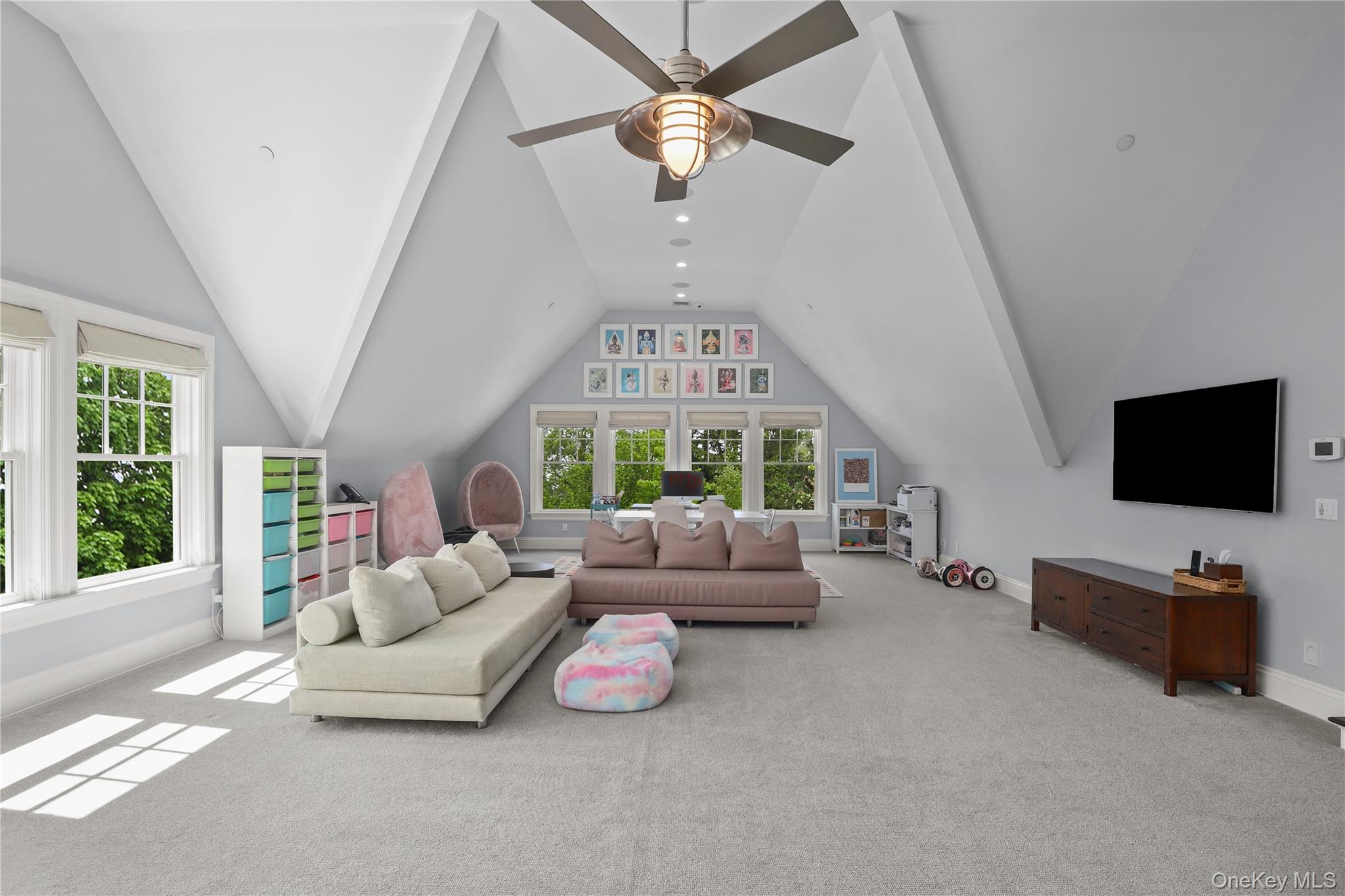 6 Stone Bridge Road Purchase, NY 10577 - Photo 26 of 45 a living room with furniture and a flat screen tv