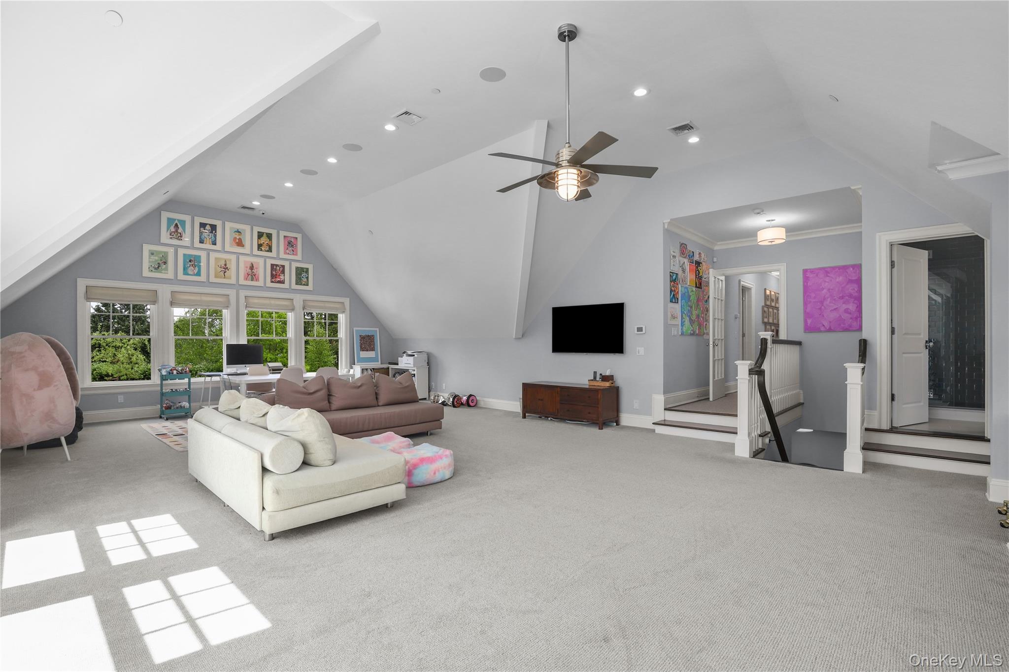 6 Stone Bridge Road Purchase, NY 10577 - Photo 27 of 45 a living room with furniture a flat screen tv and a large window