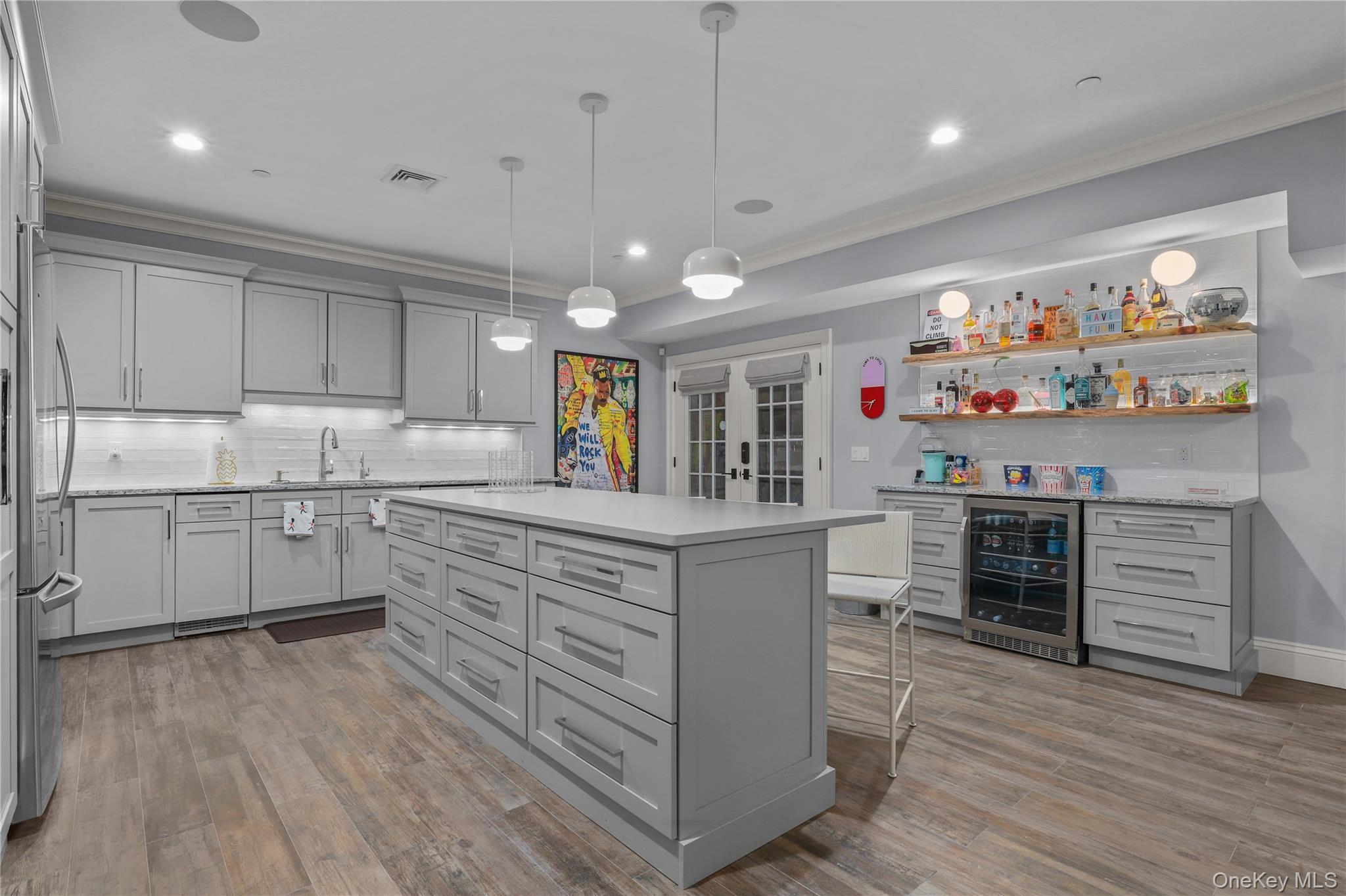 6 Stone Bridge Road Purchase, NY 10577 - Photo 31 of 45 a kitchen with stainless steel appliances cabinets and wooden floor