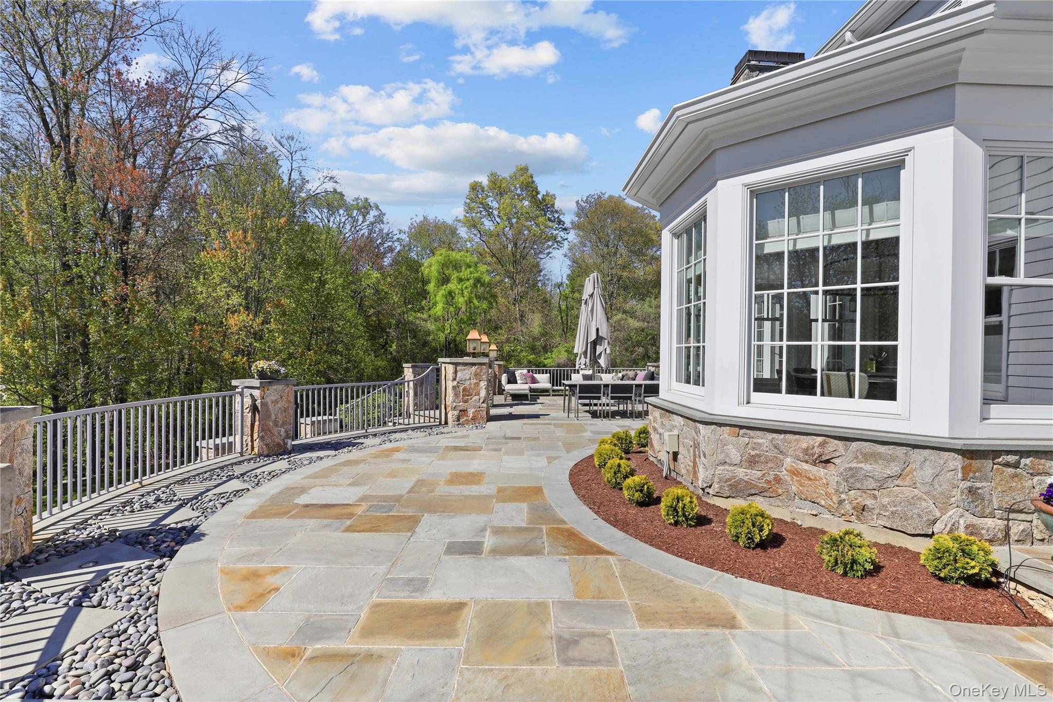 6 Stone Bridge Road Purchase, NY 10577 - Photo 36 of 45 a swimming pool with plants