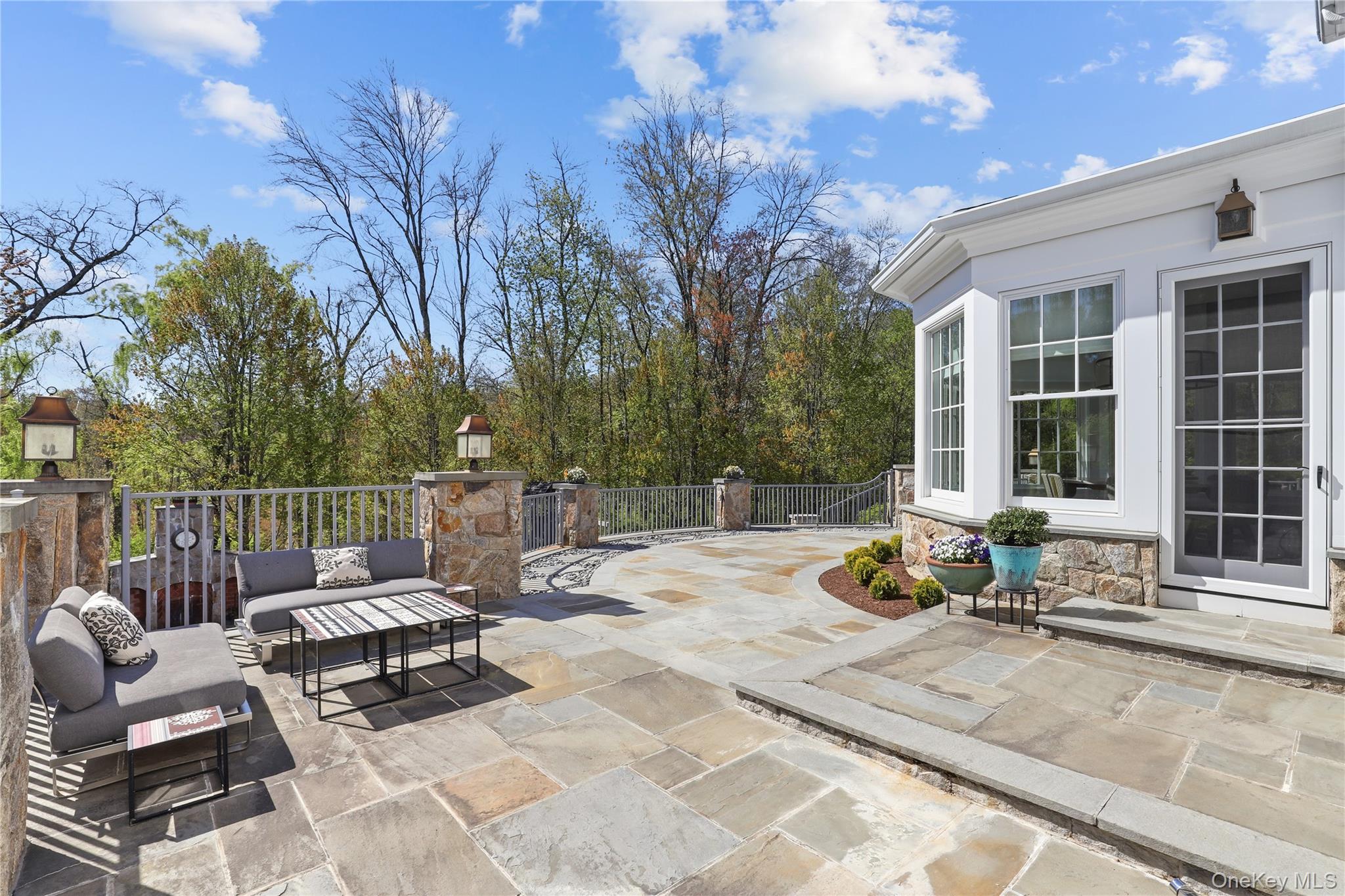 6 Stone Bridge Road Purchase, NY 10577 - Photo 37 of 45 a view of a patio with a chairs and wooden fence