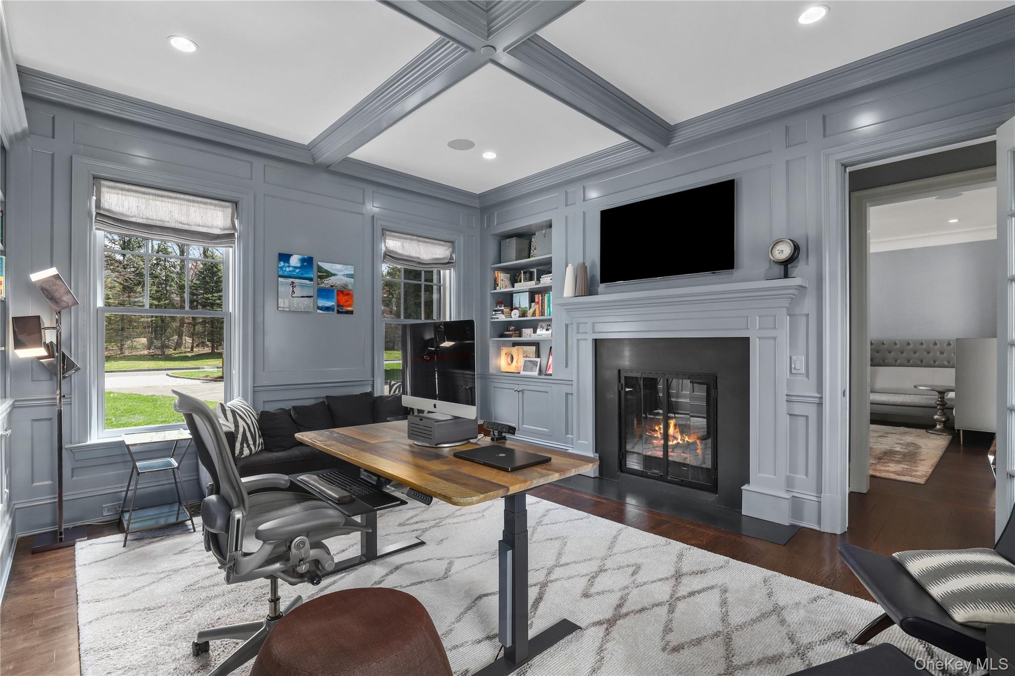 6 Stone Bridge Road Purchase, NY 10577 - Photo 6 of 45 a living room with furniture a flat screen tv and a fireplace