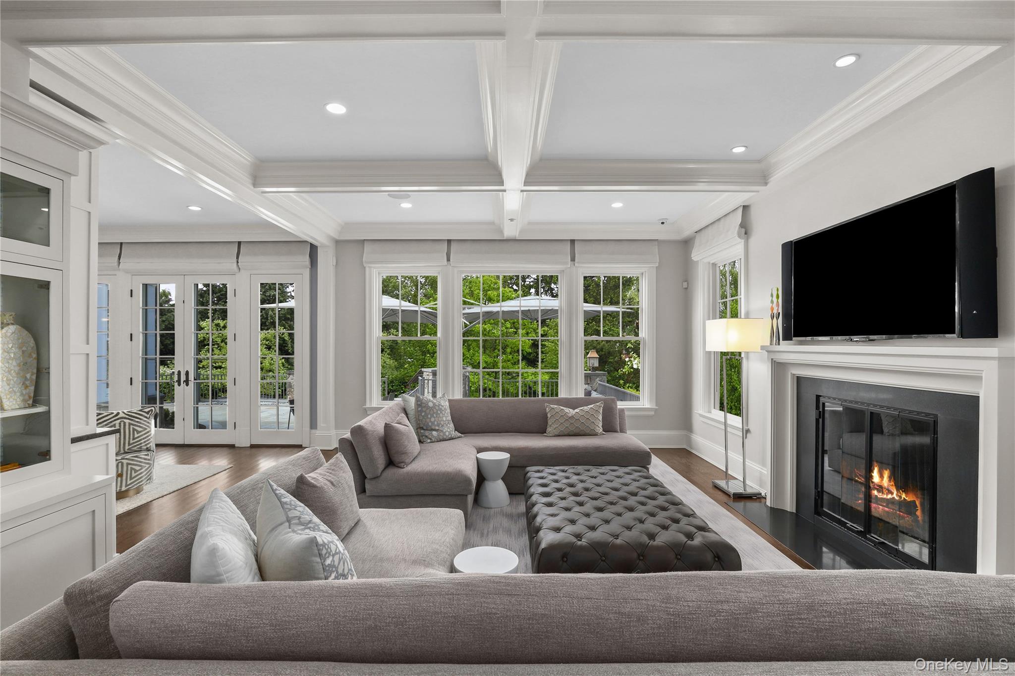 6 Stone Bridge Road Purchase, NY 10577 - Photo 7 of 45 a living room with furniture a flat screen tv and a fireplace