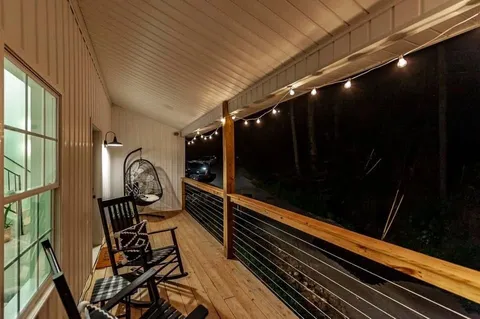 a room with lots of wooden floor and furniture
