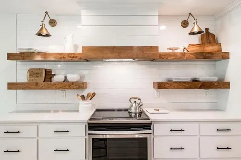 a kitchen with a stove and cabinets
