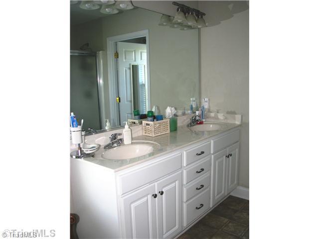 286 Crousetown Road Lexington, NC 27292 - Photo 13 of 16 Master Bath/Spa. The master bath has a duel vanity set in beautiful cabinetry, a jetted tub and separate shower.
