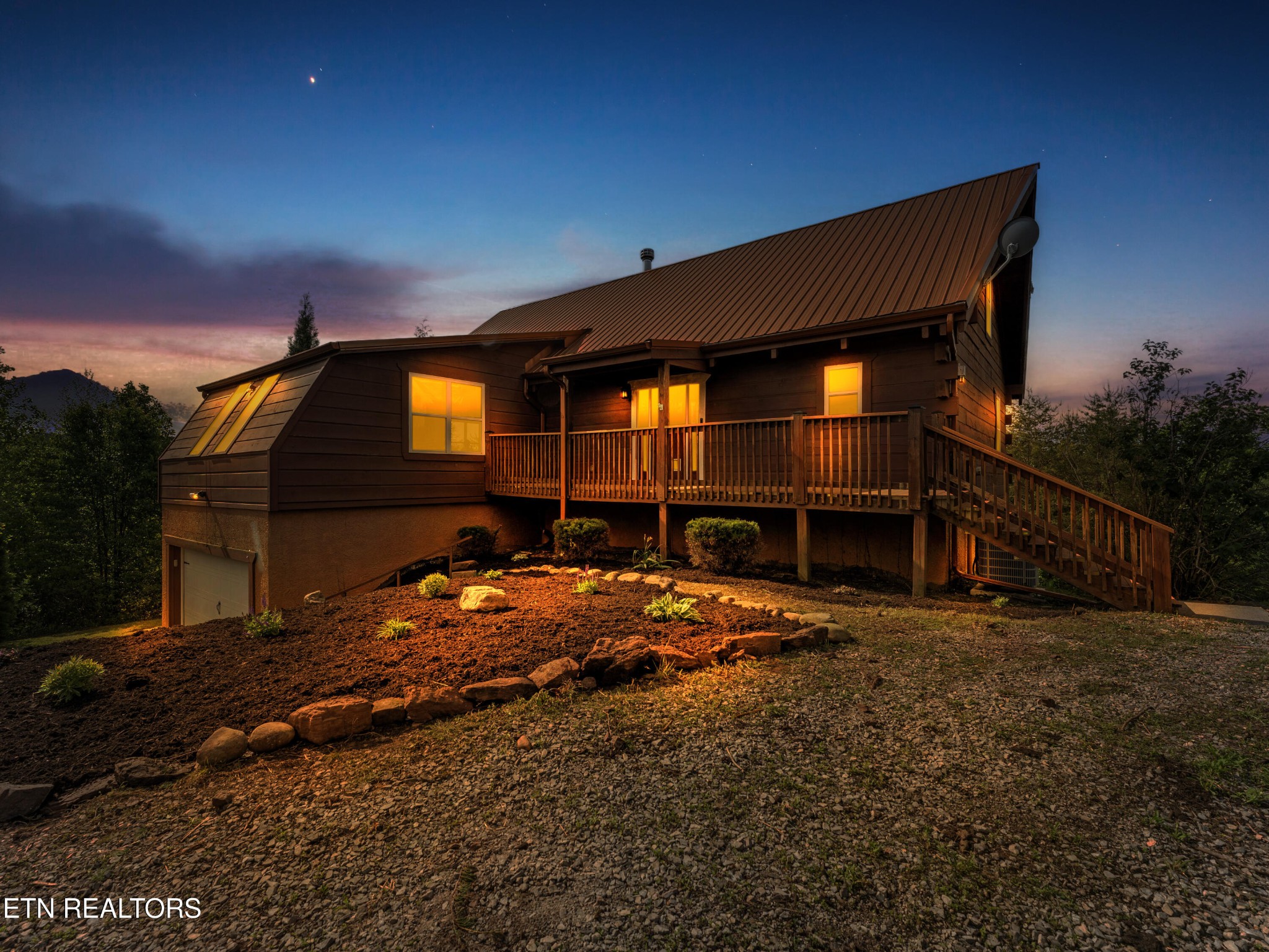 a backyard of a house with wooden fence