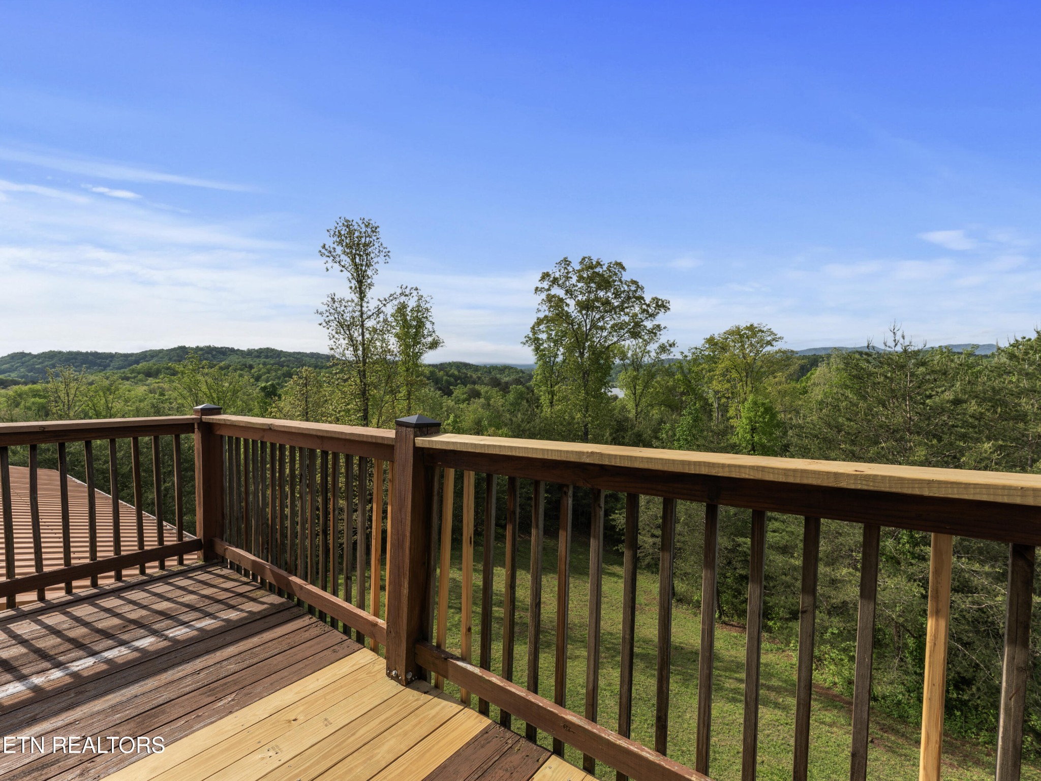 155 George Thomas Road Vonore, TN 37885 - Photo 32 of 51 a balcony with wooden floor and fence