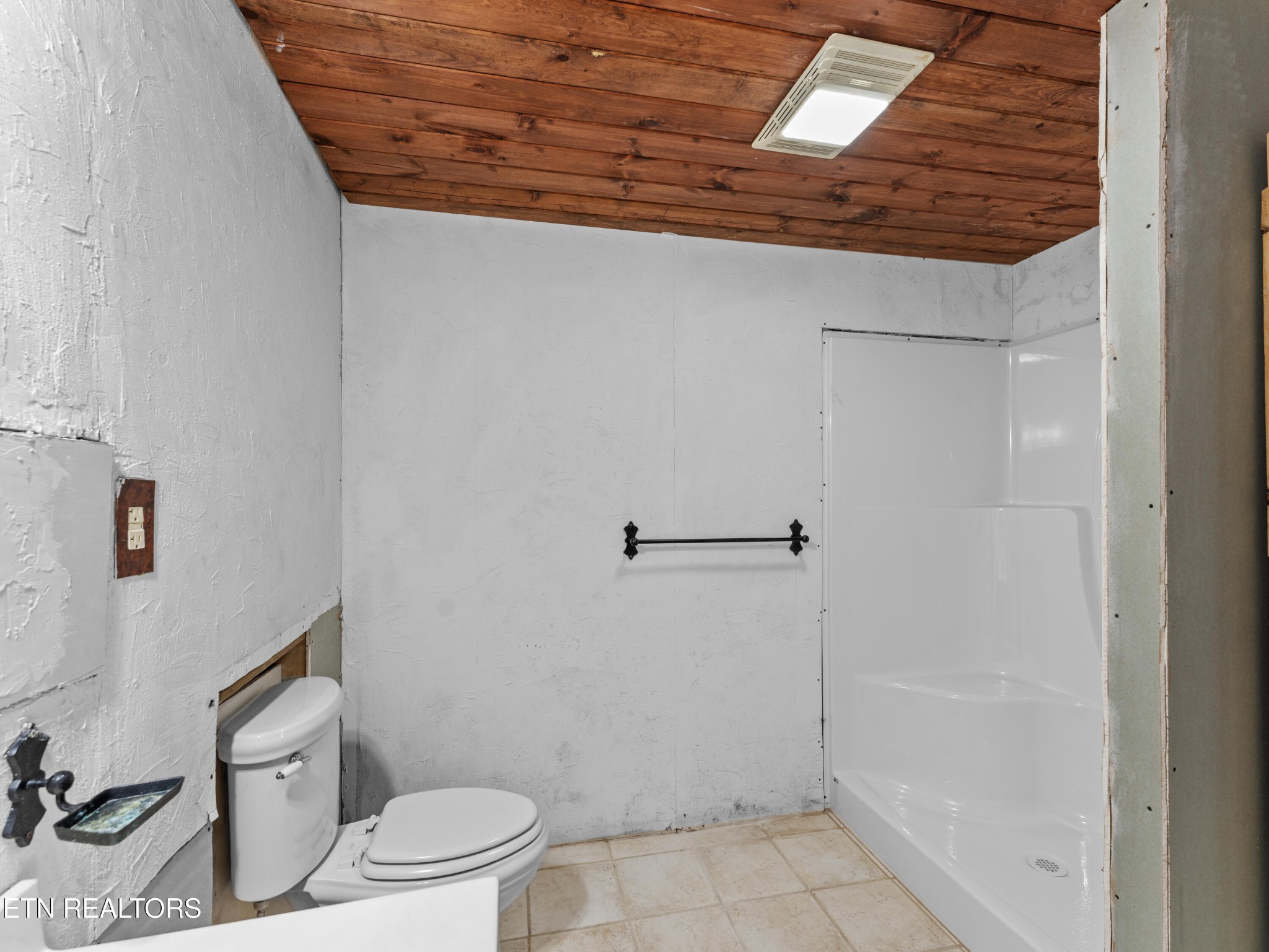 155 George Thomas Road Vonore, TN 37885 - Photo 46 of 51 a bathroom with a granite countertop bathtub and toilet