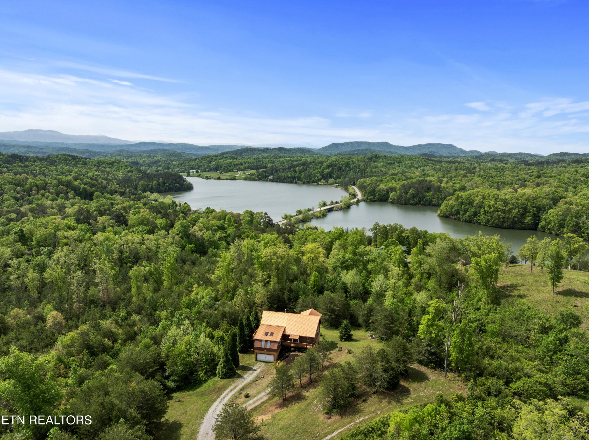 155 George Thomas Road Vonore, TN 37885 - Photo 48 of 51 a view of a lake with a mountain in the background