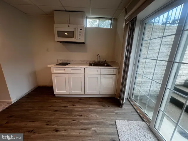 a room with a sink and a mirror