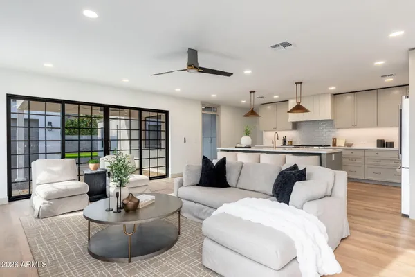 a living room with furniture and a large window