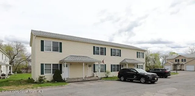 a view of a car park in front of house