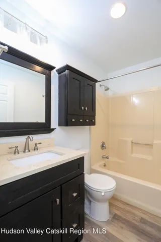 a bathroom with a toilet a sink and a bathtub