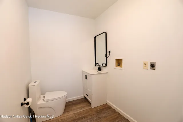 a bathroom with a toilet and a sink