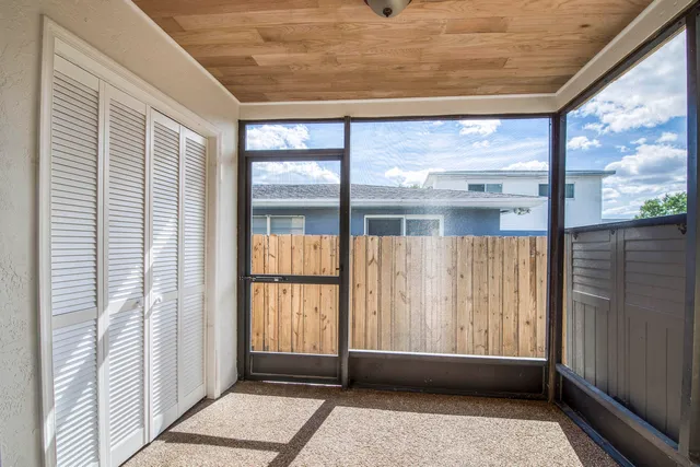 a view of entryway with a floor to ceiling window