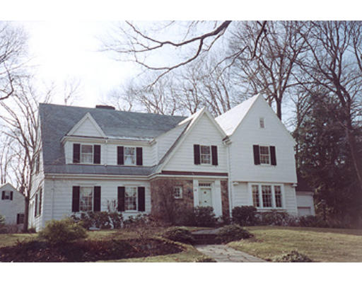 52 Woodcliff Road Wellesley, MA 02481 - Photo 1 of 1 a front view of house with yard and trees around